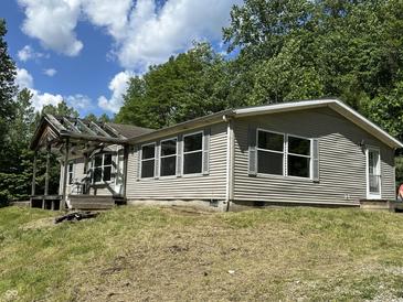 Ranch style home with a light colored exterior, open porch and windows with light colored trim at 3587 Lower Patton Park Rd, Martinsville, IN 46151