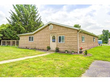 Charming home featuring a well-maintained lawn and inviting exterior, ideal for Gathering living at 8879 W County Road 700 S, Coatesville, IN 46121