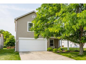 Charming two-story home with attached garage and mature landscaping at 10273 Haag Rd, Brownsburg, IN 46112