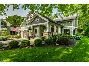 Charming craftsman-style home with well-manicured lawn and inviting front porch at 140 4Th Nw St, Carmel, IN 46032