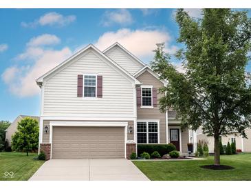 Charming two-story home with a two-car garage and well-manicured lawn at 14514 Glapthorn Rd, Fishers, IN 46037