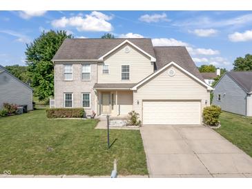 Charming two-story home featuring a combination of brick and vinyl siding with an attached two car garage at 2326 Gradison Cir, Indianapolis, IN 46214