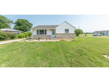 Charming single Gathering home featuring a well-manicured lawn and stone accents at 272 Jefferson St, Columbus, IN 47201