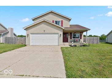 Charming two-story home with a well-manicured lawn and a two-car garage, perfect for suburban living at 4605 Clairmont Dr, Columbus, IN 47203