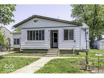 Charming single-story home with a well-maintained lawn and welcoming entrance at 719 Melvenia St, Indianapolis, IN 46219