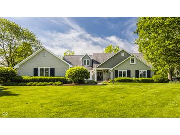 Charming home with a lush lawn, mature trees, and inviting curb appeal at 11823 E 200 S, Zionsville, IN 46077