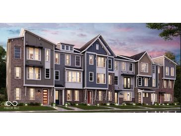 Charming townhome exteriors showcasing diverse architectural styles and inviting curb appeal in a Primary planned community at 7343 Bayview Run # 11-604, McCordsville, IN 46055