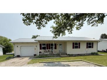 Charming single-story home featuring a metal roof, light siding, and a cozy front porch at 106 9Th St, New Market, IN 47965