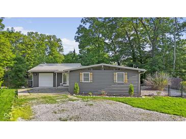 Charming home with gray siding, decorative shutters, and a well-maintained front yard at 5570 Paradise Ct, Martinsville, IN 46151