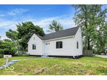 Charming single-story home featuring white siding, a well-maintained lawn, and a classic design at 701 E Memorial Dr, Muncie, IN 47302