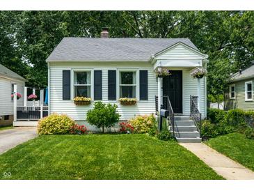 Charming home featuring well-manicured lawn, flower boxes and vibrant landscaping at 250 N 18Th Ave, Beech Grove, IN 46107