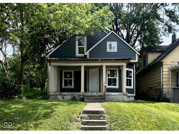 Charming two-story home with a covered front porch and freshly painted exterior at 2955 N Olney St, Indianapolis, IN 46218