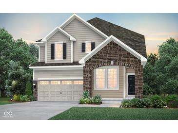Charming two-story home featuring stone accents, neutral siding, and well-manicured landscaping at 7211 Stetson Dr, Whitestown, IN 46075