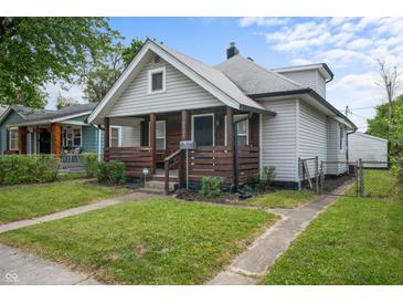 Charming home with a well-maintained lawn and inviting front porch at 1529 E Tabor St, Indianapolis, IN 46203