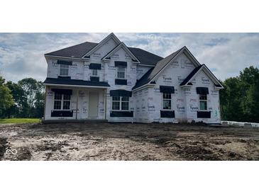 Two-story home with white exterior and black accents under construction, ready to be personalized with landscaping at 1919 Delp Ct, Avon, IN 46123