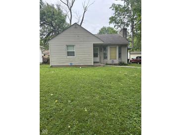 Quaint single-story home with gray siding and a well-maintained front lawn at , Indianapolis, IN 46218