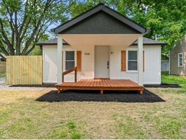 Charming home featuring a quaint front porch and lovely light-colored exterior at 5136 Miller St, Indianapolis, IN 46241