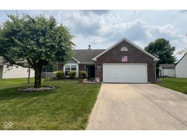 Charming single-story brick home with mature landscaping and a two-car attached garage at 7175 Oakview Dr, Avon, IN 46123