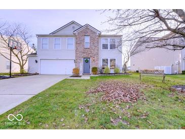 Charming two-story home featuring a brick facade and well-manicured lawn at 10197 Apple Blossom Cir, Fishers, IN 46038