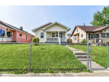 Charming single-Gathering home featuring a cozy front porch and well-maintained lawn at 1619 E Bradbury Ave, Indianapolis, IN 46203