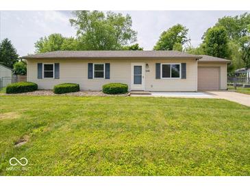 Charming ranch-style home featuring a well-maintained lawn, blue shutters, and an attached one car garage at 6408 Old Mill Dr, Indianapolis, IN 46221
