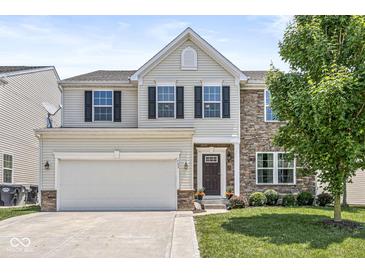 Charming two-story home with a two-car garage, stone accents, and well-maintained landscaping at , Greenwood, IN 46143