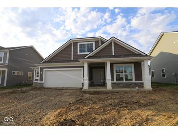 Charming new construction home featuring a covered porch and an attached two-car garage at 10132 Redwood Peak Ln, Indianapolis, IN 46259