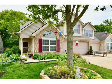 Charming home featuring a landscaped yard, brick accents, and a cozy front porch at 2805 Rylee Ct, Greenwood, IN 46143