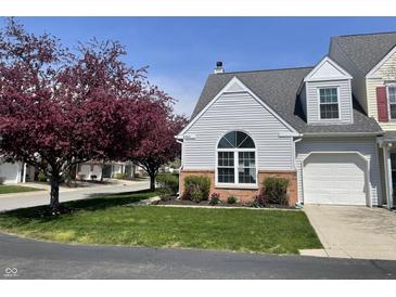 Charming home with a well-manicured lawn, beautiful landscaping, and a single-car garage in a residential neighborhood at 9664 Legare St # 2601, Fishers, IN 46038