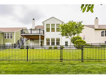 A spacious backyard and a large deck make this home perfect for outdoor entertainment at 13091 Duval Dr, Fishers, IN 46037