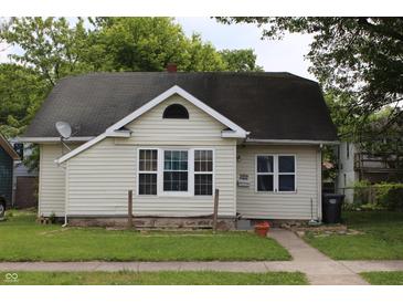 Charming single-story home with neutral siding, black roof and well-maintained lawn at 2232 Fairview St, Anderson, IN 46016