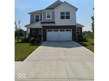 Charming two-story home featuring a brick facade and a well-manicured lawn at 17255 Seaboard Pl, Noblesville, IN 46060