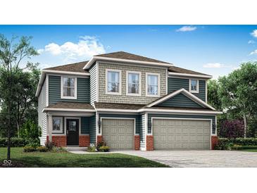 Charming two-story home featuring a three-car garage, craftsman-style columns, and a beautifully landscaped front yard at 3694 Andean Dr, Bargersville, IN 46106