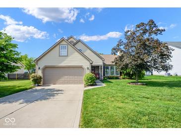 Charming home with a two-car garage, beautiful landscaping, and a well-maintained lawn at 4342 Sequoia Ct, Greenwood, IN 46143