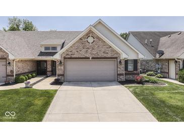 Charming single-story home with a brick facade, attached garage, and well-manicured lawn at 5351 Abbington Ave, Plainfield, IN 46168