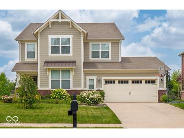 Charming two-story home with a well-manicured lawn and a two-car garage at 5684 Autumn Trl, Brownsburg, IN 46112