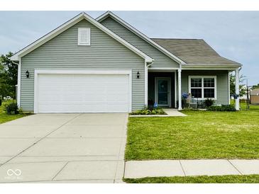 Charming single Gathering home with a two-car garage, manicured lawn, and quaint front porch at 7611 Cloudy Ct, Camby, IN 46113
