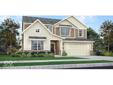 Charming two-story home with a two-car garage, a mix of siding and brick, and a well-manicured front yard at 942 Shadow Dr, Danville, IN 46122