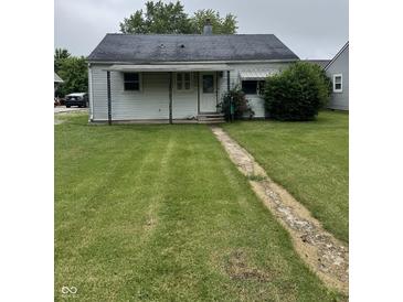Charming single-story home with a well-maintained lawn and inviting front porch at 1609 N Outer Dr, Lebanon, IN 46052
