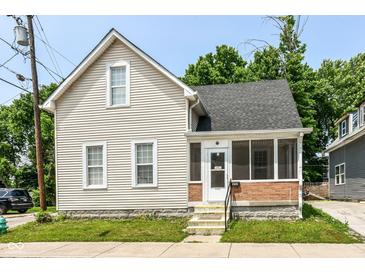 Charming two-story home with a screened-in porch and classic architectural details on a well-maintained lot at 352 W 28Th St, Indianapolis, IN 46208