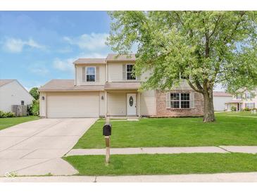 Charming two-story home features a well-manicured lawn, brick accents, and a welcoming front entrance at 6320 River Valley Way, Indianapolis, IN 46221
