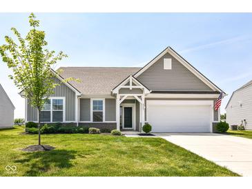 Charming home with a well-manicured lawn, gray siding, and a two-car garage at 8263 Bryce Blvd, Pendleton, IN 46064