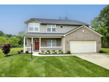 Charming two-story home with a welcoming front porch and manicured lawn at 19187 Outer Bank Rd, Noblesville, IN 46062