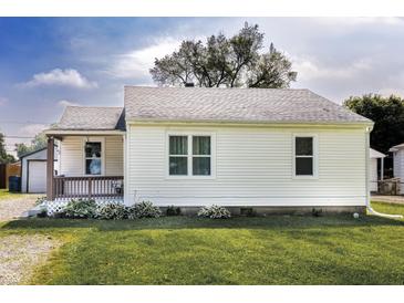 Charming home featuring a cozy front porch and well-maintained lawn at 321 S Biltmore Ave, Indianapolis, IN 46241