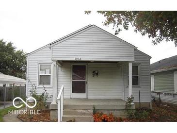 Charming bungalow style home features covered entry, classic siding, and a cozy welcoming feel at 3954 Fletcher Ave, Indianapolis, IN 46203
