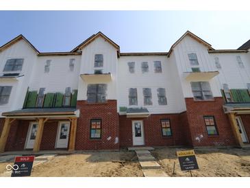 New construction townhome with white siding and brick accents at 7063 Pate Hollow Dr, Brownsburg, IN 46112
