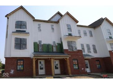New construction townhome featuring brick accents and white siding at 7071 Pate Hollow Dr, Brownsburg, IN 46112