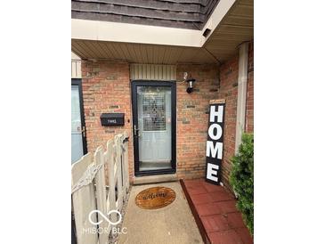 Charming brick home with a welcoming front entrance and 