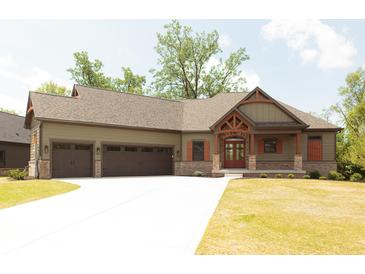 Craftsman-style home with a three-car garage, wood accents, brick details, and well-manicured lawn at 0 Legacy Estates Lot 2, Mooresville, IN 46158
