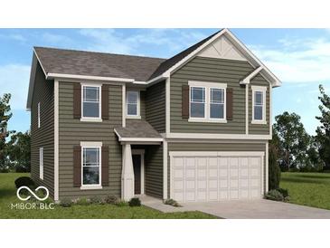 Charming two-story home with olive green siding, a two-car garage, and decorative shutters at 2040 White Oak Dr, Shelbyville, IN 46176